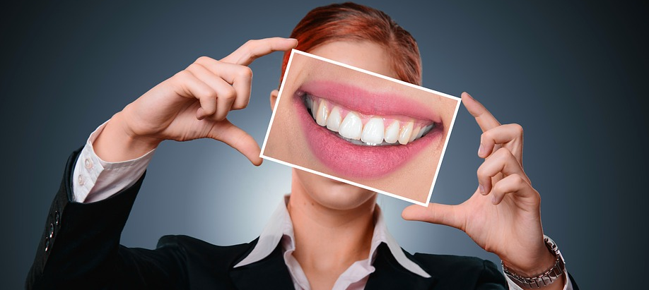 woman with photo of teeth
